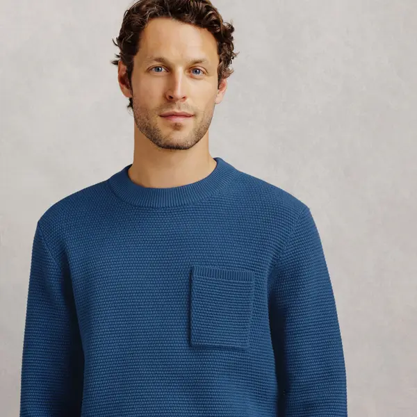 Pull col rond point de riz poche poitrine