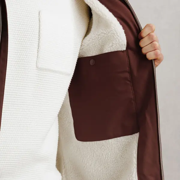 Parka longue à capuche doublée en sherpa