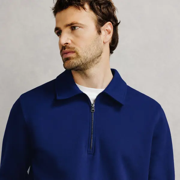 Sweat col polo zippé uni