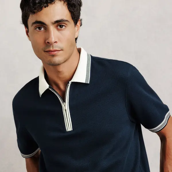 Polo manches courtes col zippé gaufré