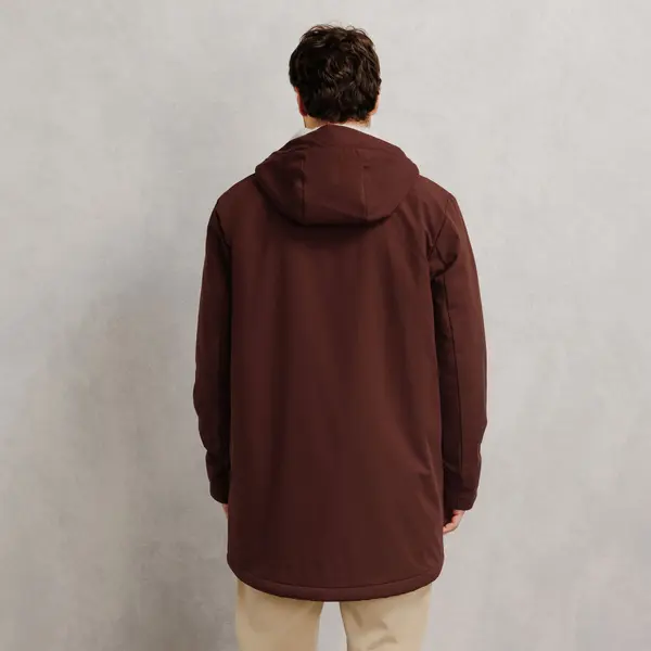Parka longue à capuche doublée en sherpa
